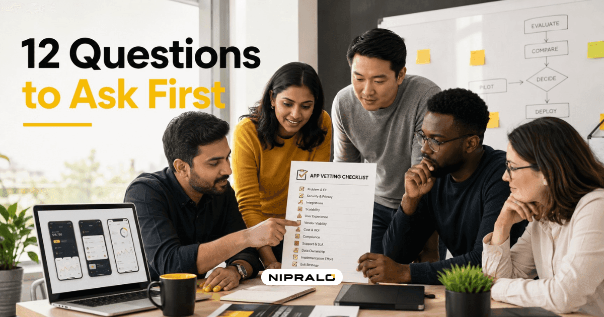 Diverse team of founders and developers reviewing a mobile app development company checklist on a laptop and whiteboard in a bright modern office